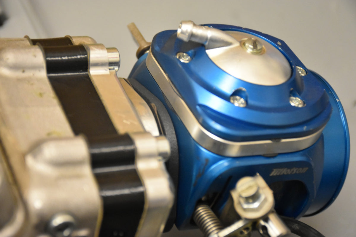 TM OK reed block spacer fitted between engine and carburettor